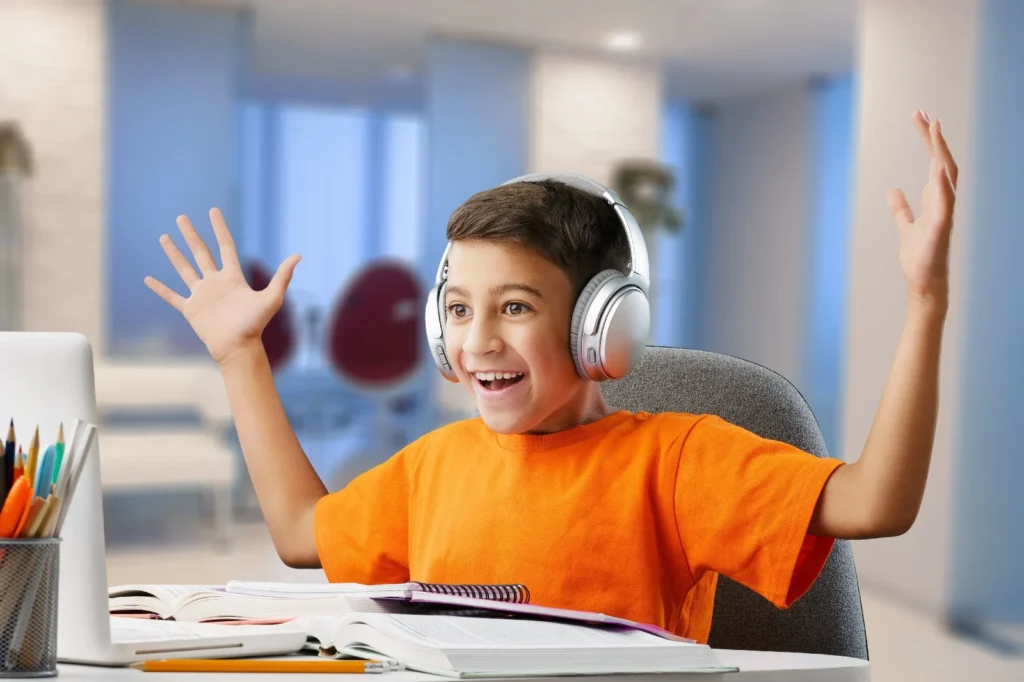 a-surprised-happy-kid-looking-at-his-laptop