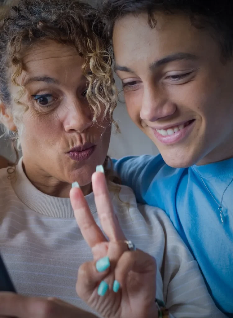 mom-and-son-taking-selfies-smilling